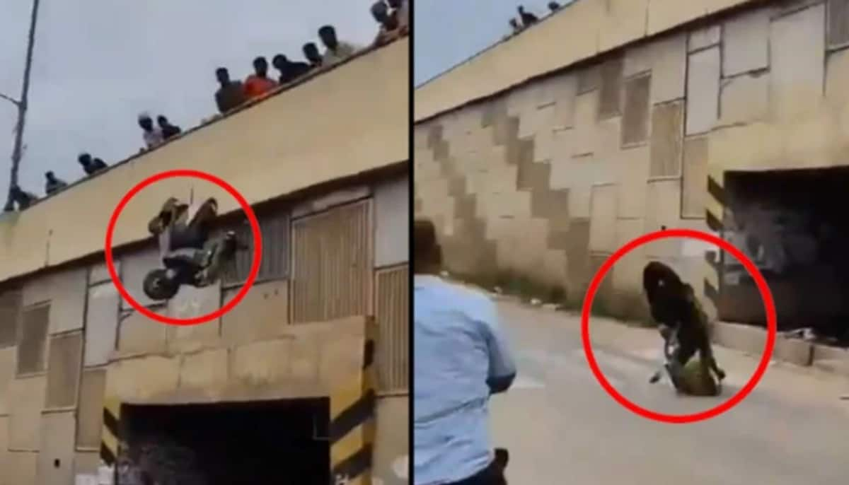 Angry crowd throw Scooters from flyover after performing stunts on the busy road at Bengalooru