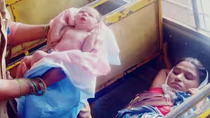 Labor pain while traveling in bus telangana Woman gives birth in TSRTC bus with help of nurse lady conductor 