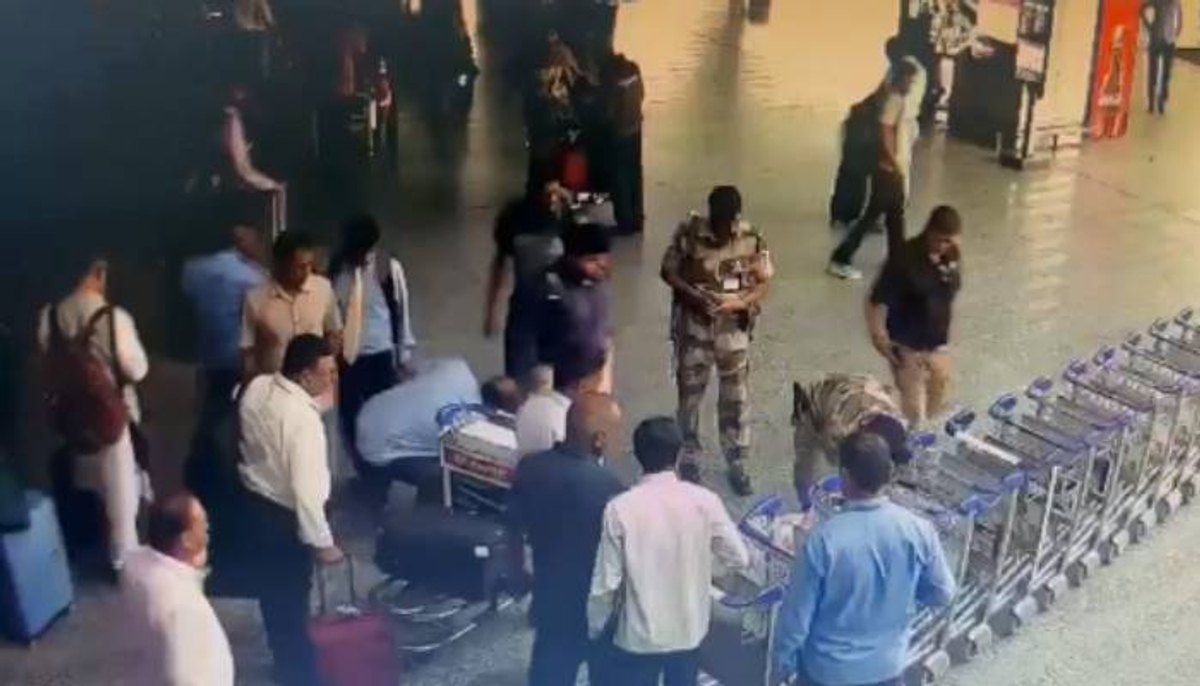 man collapses at delhi airport cisf jawan giving cpr and saves life video 