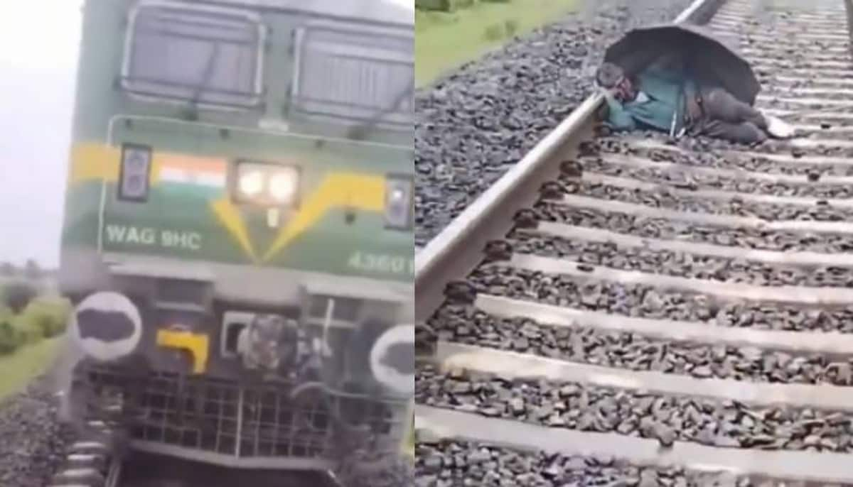 man sleeping on railway track train halt