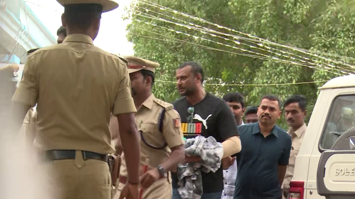 Police removes Actor darshan neck chain hand thread before entering ballari jail ckm