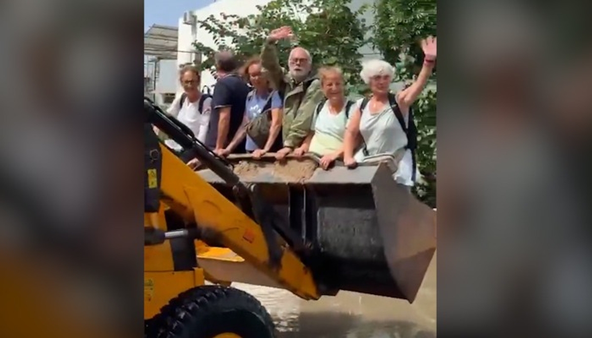 Gujarat floods: Foreign tourists enjoy ride on bulldozer amid Vadodara deluge; video goes viral (WATCH) snt