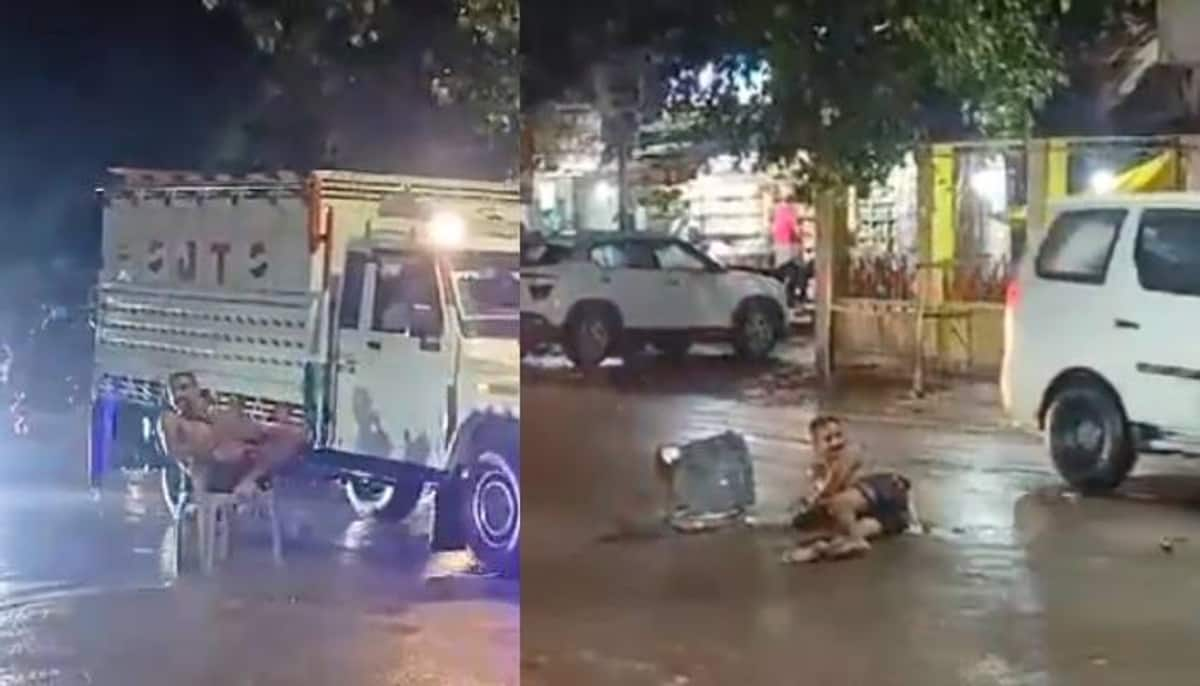 man sitting in middle of road in a chair video viral 