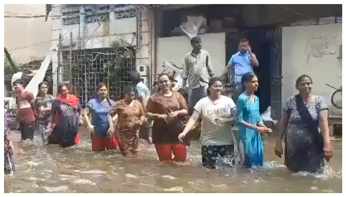 video of Young men and women danced garba on a street submerged in knee-deep water at Vadodara goes viral 