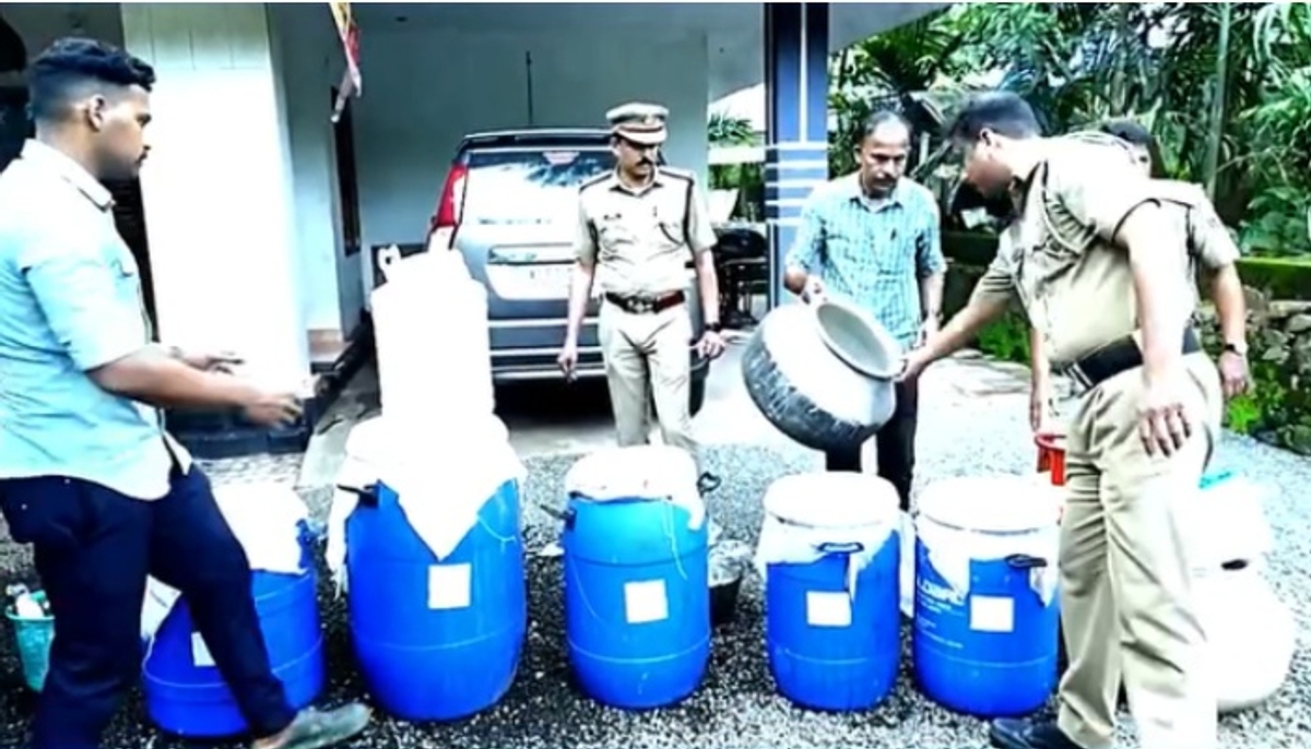 large scale arrack production aiming onam celebrations on the terrace of a house in Malappuram