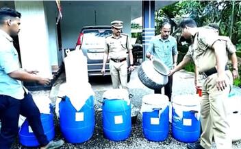 large scale arrack production aiming onam celebrations on the terrace of a house in Malappuram