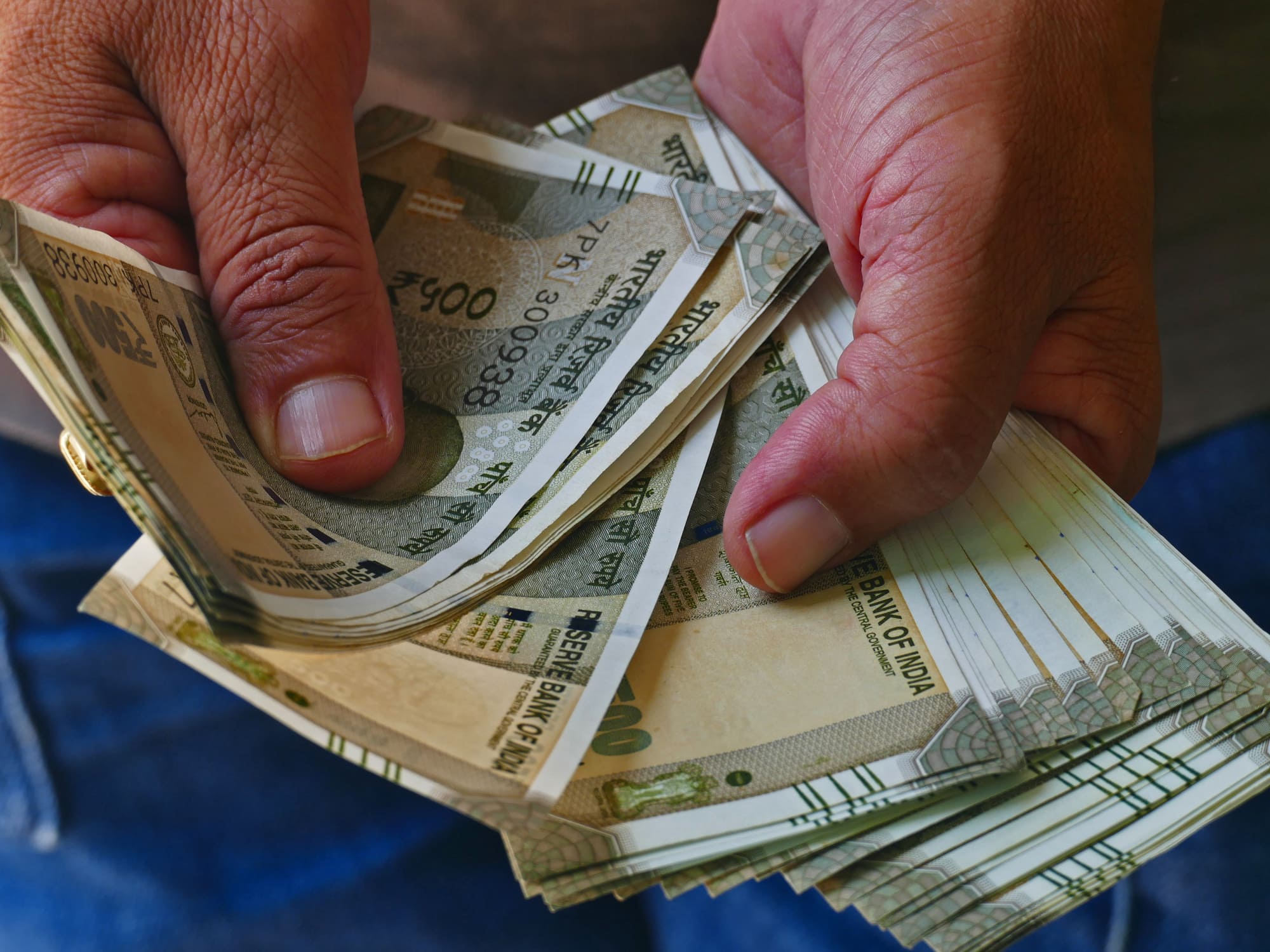 Do you lick fingers to count cash? Reasons you need to break this habit dmn