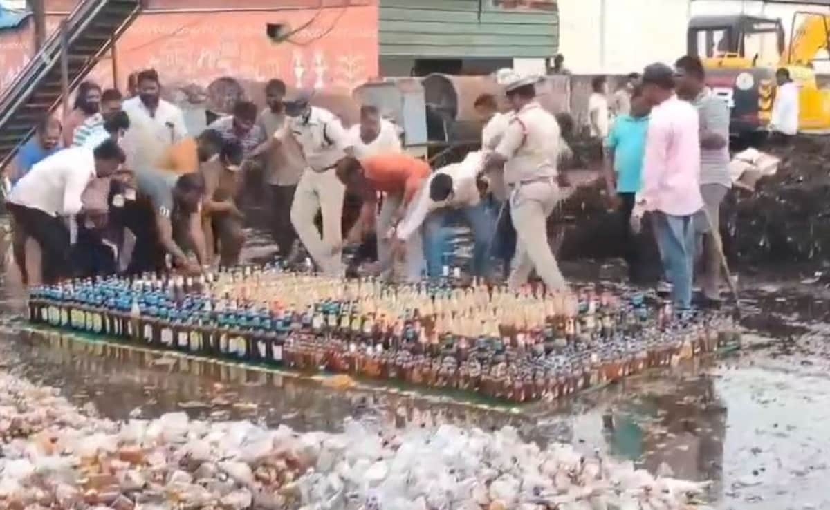 Guntur Police Try To Destroy Liquor Bottles With Bulldozer Locals Steal Them mrq