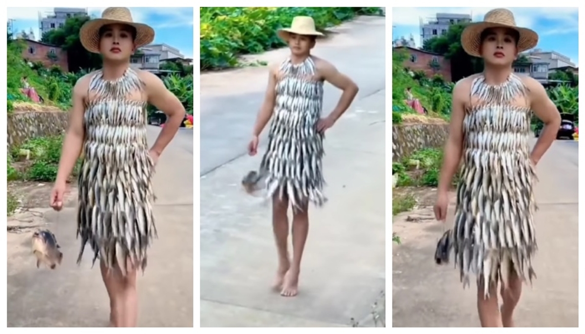 video of a model wearing a fish dress and doing a catwalk has gone viral on social media