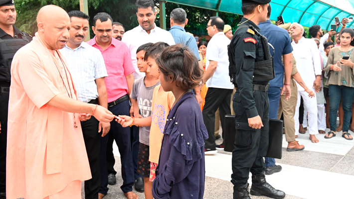 UP CM Yogi Adityanath met children during Gorakhpur temple visit gave them blessings chocolates vel