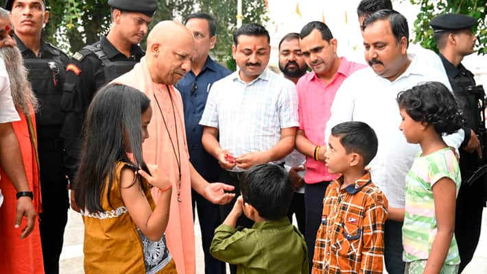 UP CM Yogi Adityanath met children during Gorakhpur temple visit gave them blessings chocolates vel