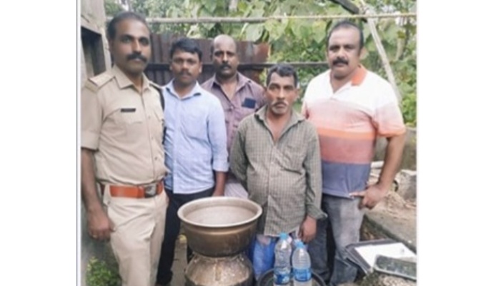 man arrested with two liters of arrack and equipments for illegal liquor distillation 