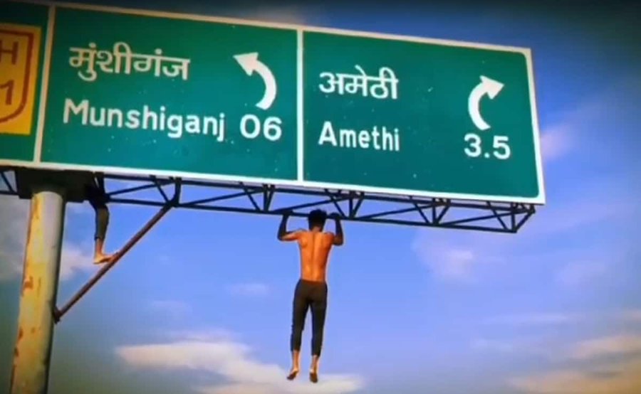 UP man takes reel game a notch higher, does pull ups on highway signboard; video goes viral (WATCH) shk