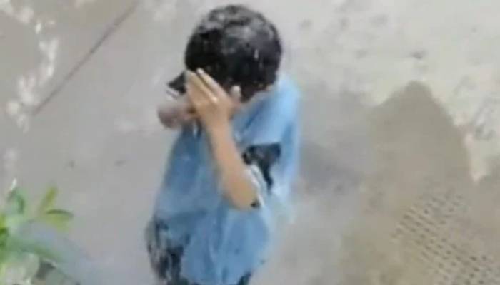 mother punishes her son for pouring water on his classmates in the same way