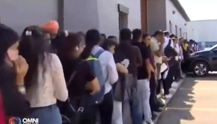 indian students in queue for waiter job in canada restaurant  