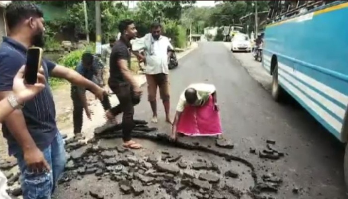 Road tarring completed during heavy rain and bitumen layer is easily getting detached from the road now