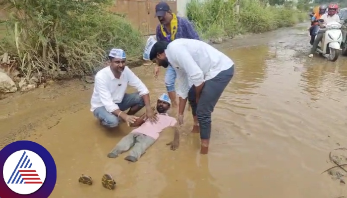 Bengaluru heavy rain AAP leader swimming in pothole water sat