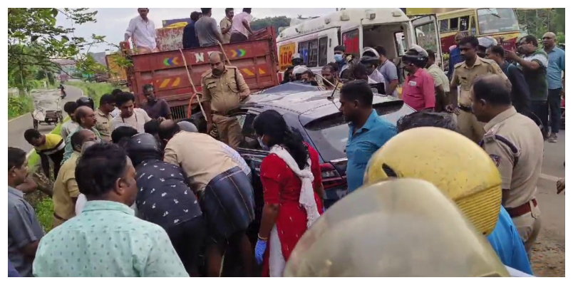 car hit at back of lorry woman dies husband and son injured in kochi