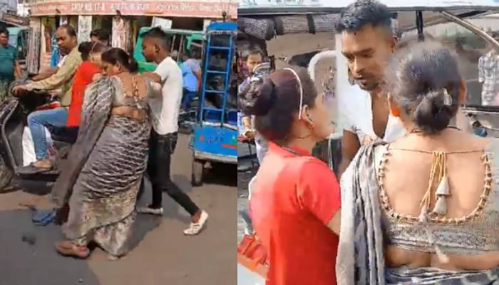 E Rickshaw driver and woman fighting each other in road  