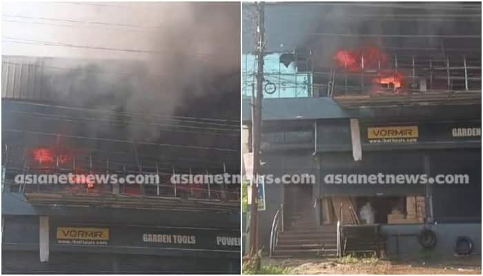 fire accident in electronic shop aluva 