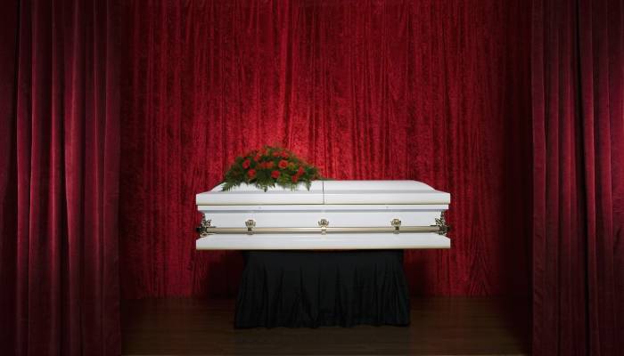 coffin lying service offered by old Japanese funeral home 