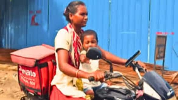 Gujarat: Zomato female delivery agent rides bike with toddler tucked to her belly, earns online praise (WATCH) shk