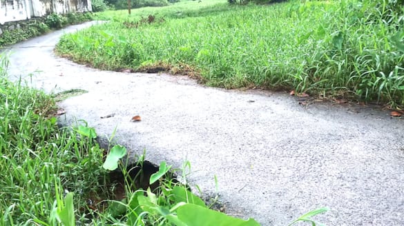 concrete road caved in danger condition in Kumarapuram