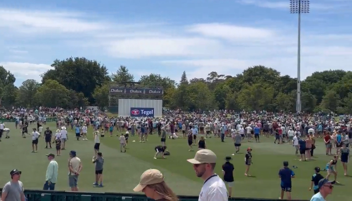 New Zealand vs England: Fans on the ground playing cricket and taking photos at the Hagley Oval during lunch break