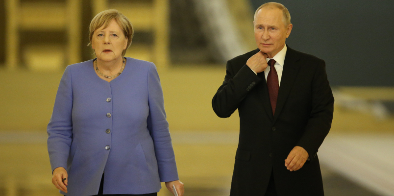 Forgive me Vladimir Putin denies allegation that he tried to scare ex German Chancellor Angela Merkel with dog