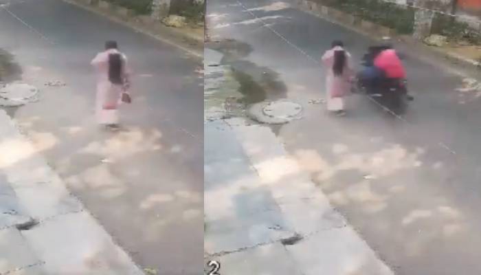 woman drag by men on bike while snatching her purse in Lucknow