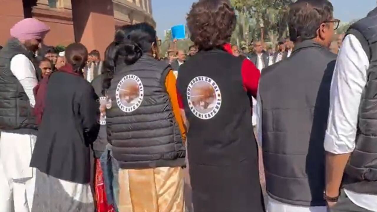 INDIA bloc MPs wear jackets reading Modi Adani ek hai 