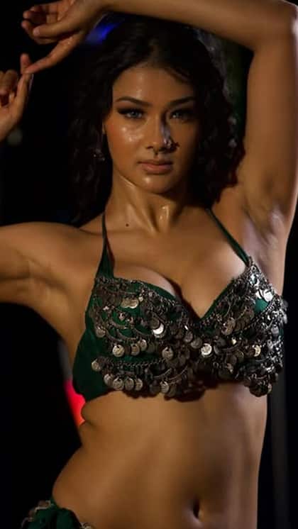 Namrata flaunts her look in a green bralette and open skirt.