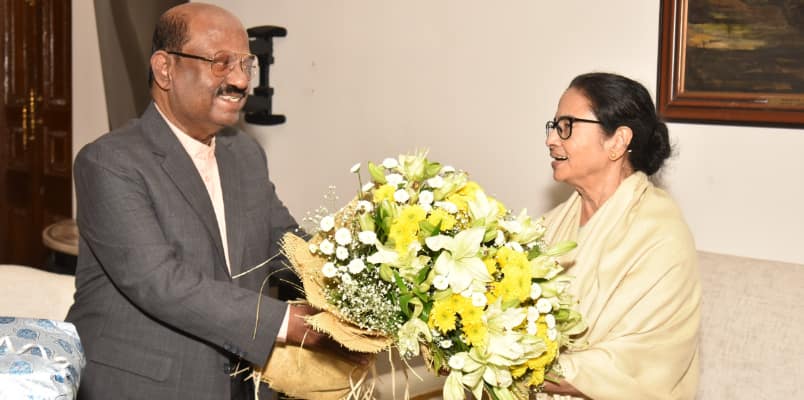 Mamata Banerjee with bouquet at Raj Bhavan Bengal Chief Minister Governor war to truce