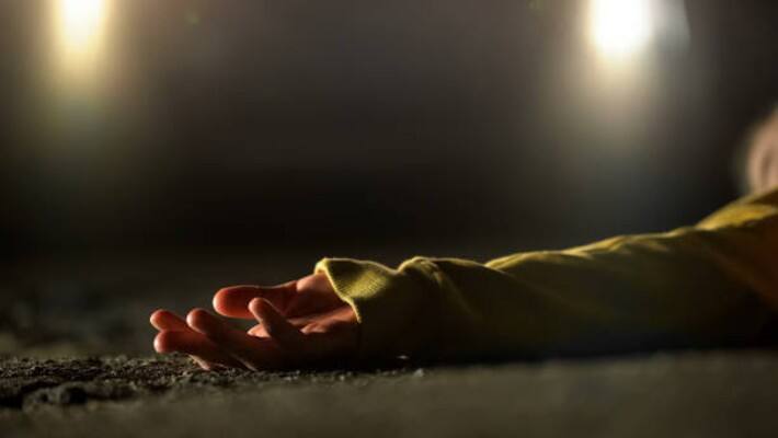 female dead body wrapped in blanket