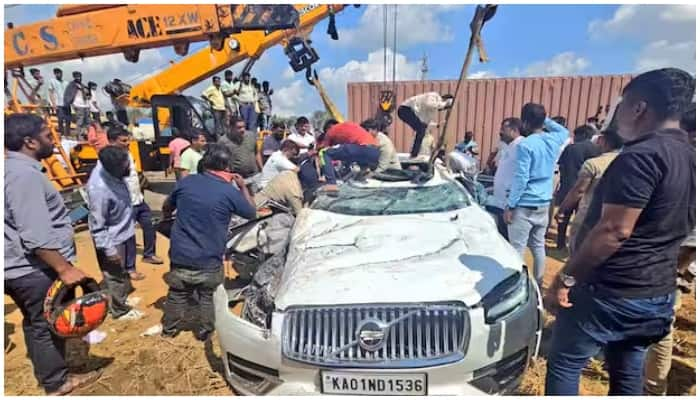 Nelamangala accident Container overturns on Volvo car Relative Veena narrowly escapes from death