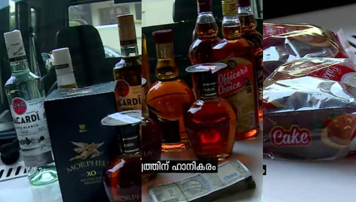 vigilance seized 12 liquor bottles and illegal cash from excise inspector vehicle in thrissur