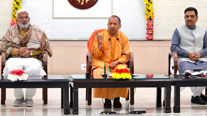 Yogi Adityanath addresses journalists at his official residence in Lucknow