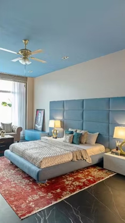 Farah's luxurious bedroom with a white and blue theme.