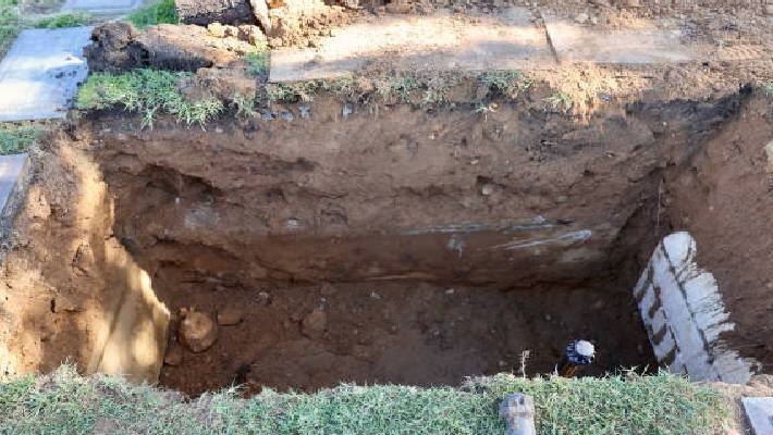 corpse taken out from the grave