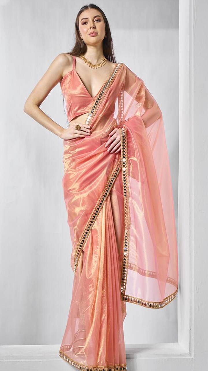 7 elegant tissue sarees in different designs that enhance the look of slim girls