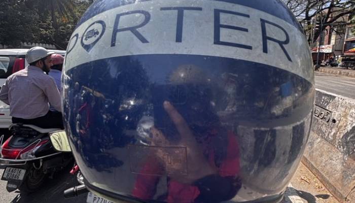 Young Man Uses Porter App for Office Commute in Bengaluru Traffic sat