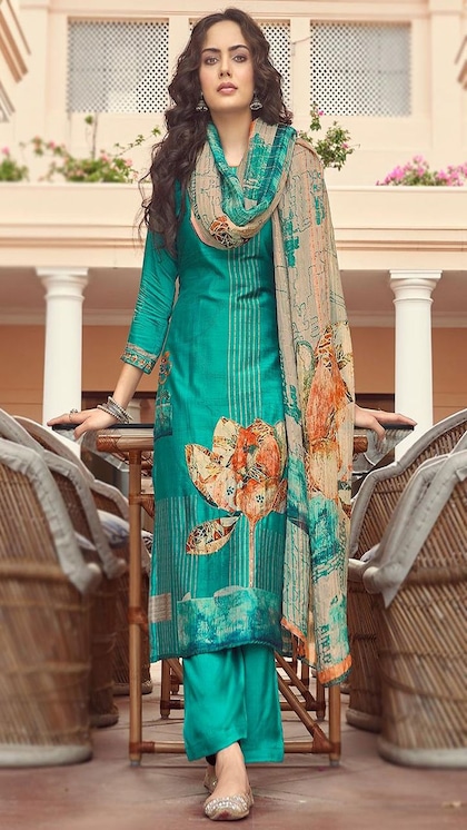 Large floral design on a soft green colored suit.