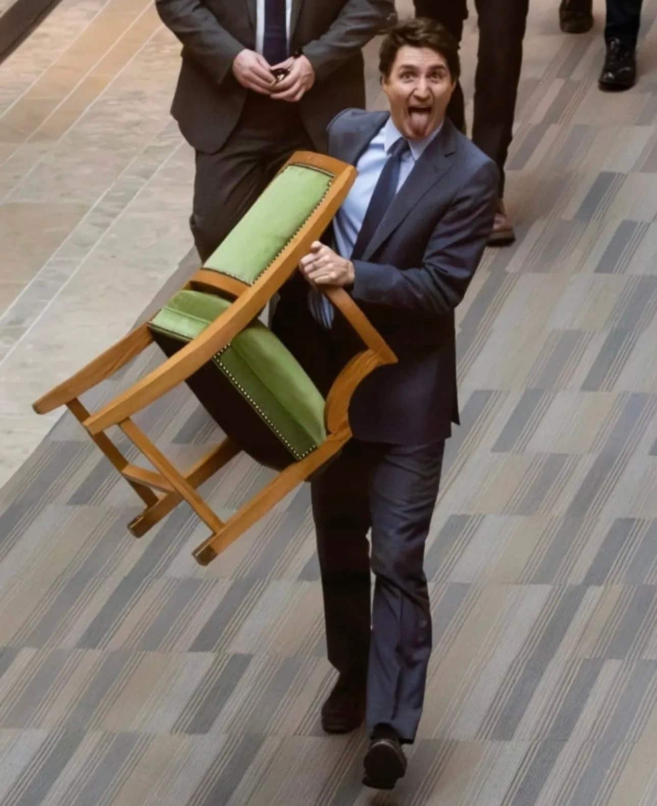 ex prime minister Justin Trudeau exits Canada Parliament with chair in hand gow