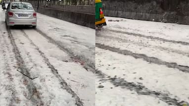 Viral Video Mysterious White Foam Appears on Bengaluru Roads After Rainfall in telugu Viral Video Mysterious White Foam Appears on Bengaluru Roads After Rainfall in telugu