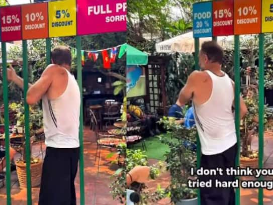 Squeezing through metal bars skinny discount in Thai restaurant sparks outrage  