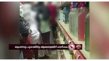 Case to be filed against father action taken in case of daughter being kept in queue at Bevco to buy liquor in Palakkad Case to be filed against father action taken in case of daughter being kept in queue at Bevco to buy liquor in Palakkad