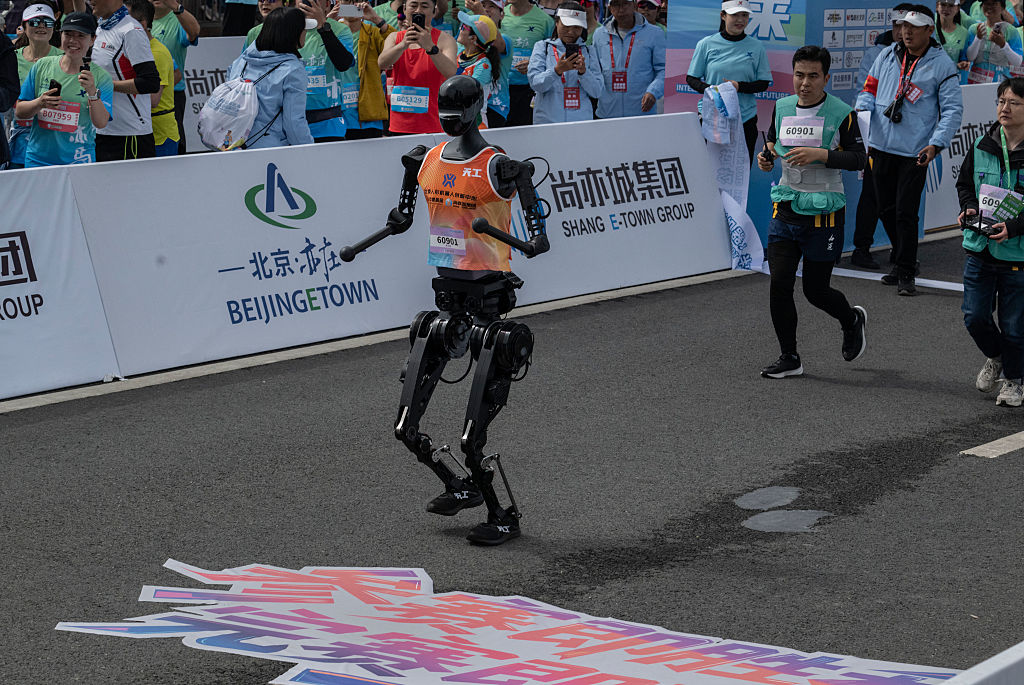 China pits humanoid robots against humans in half-marathon gow