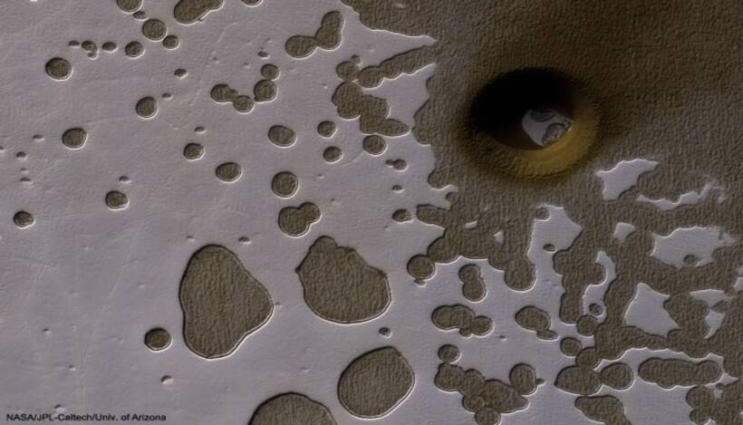 NASA spots giant 'portal' on Mars, raising hopes of life underground