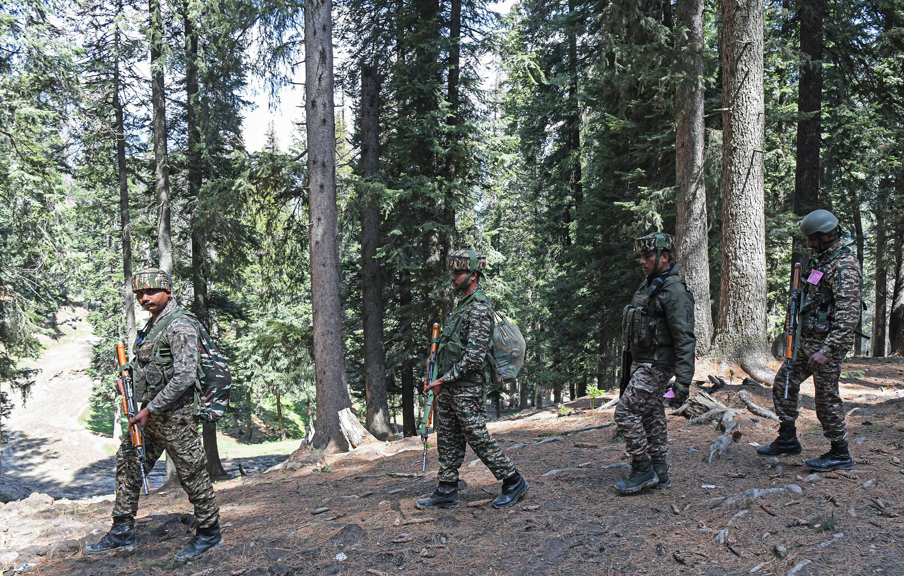 Security personnel carry out a search operation at Baisaran following the Pahalgam terrorist attack