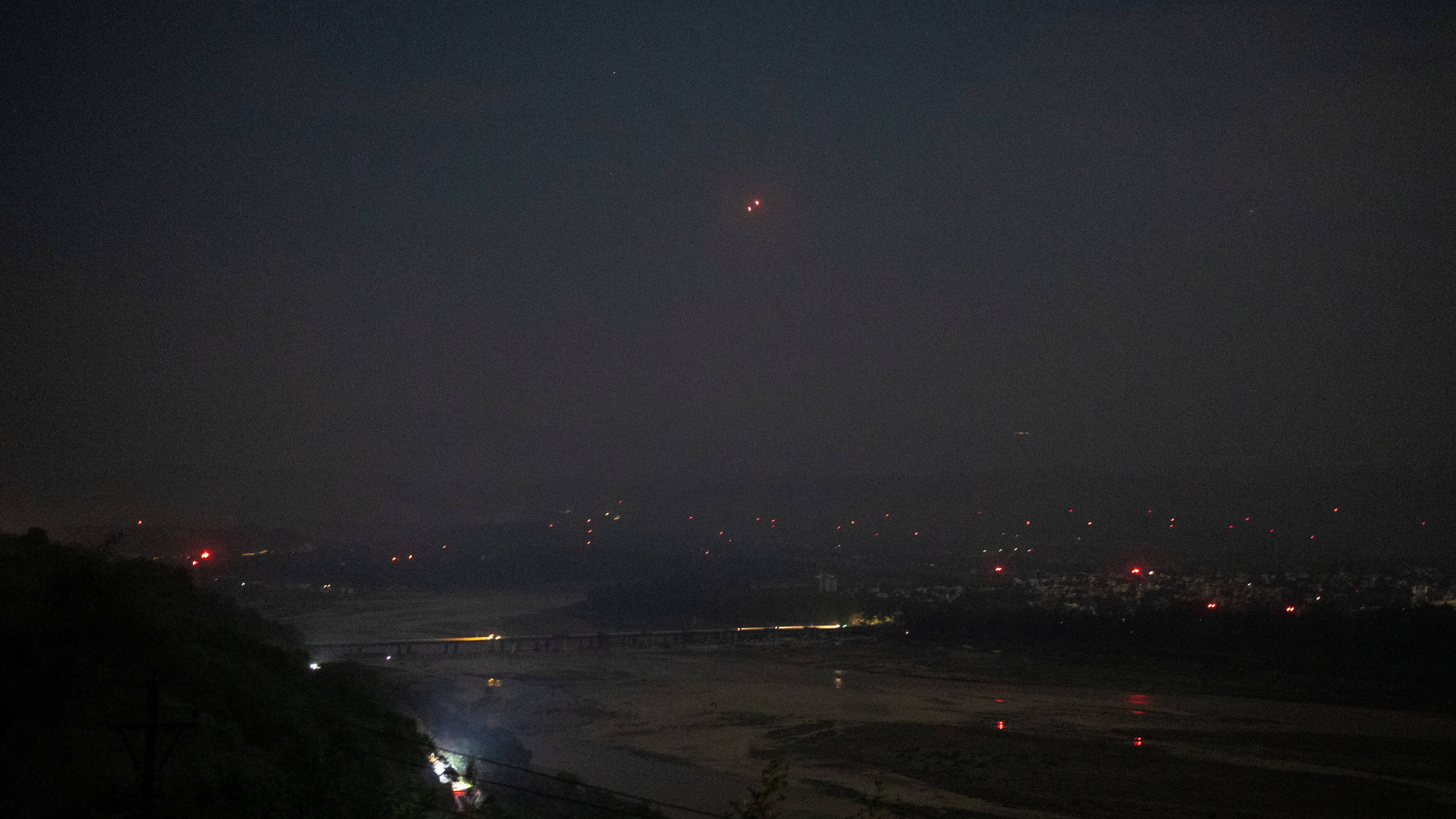 India's air defence system intercepts objects in the sky during a blackout following multiple blasts in the city of Jammu